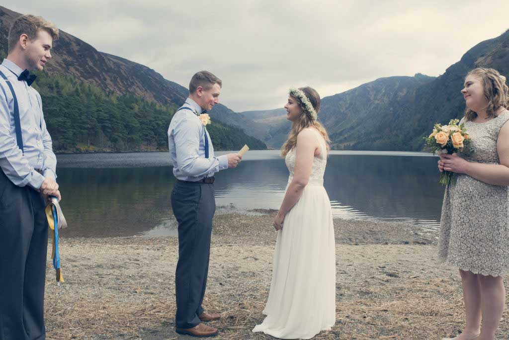 Elope to ireland at a lake at Glendalough Ireland