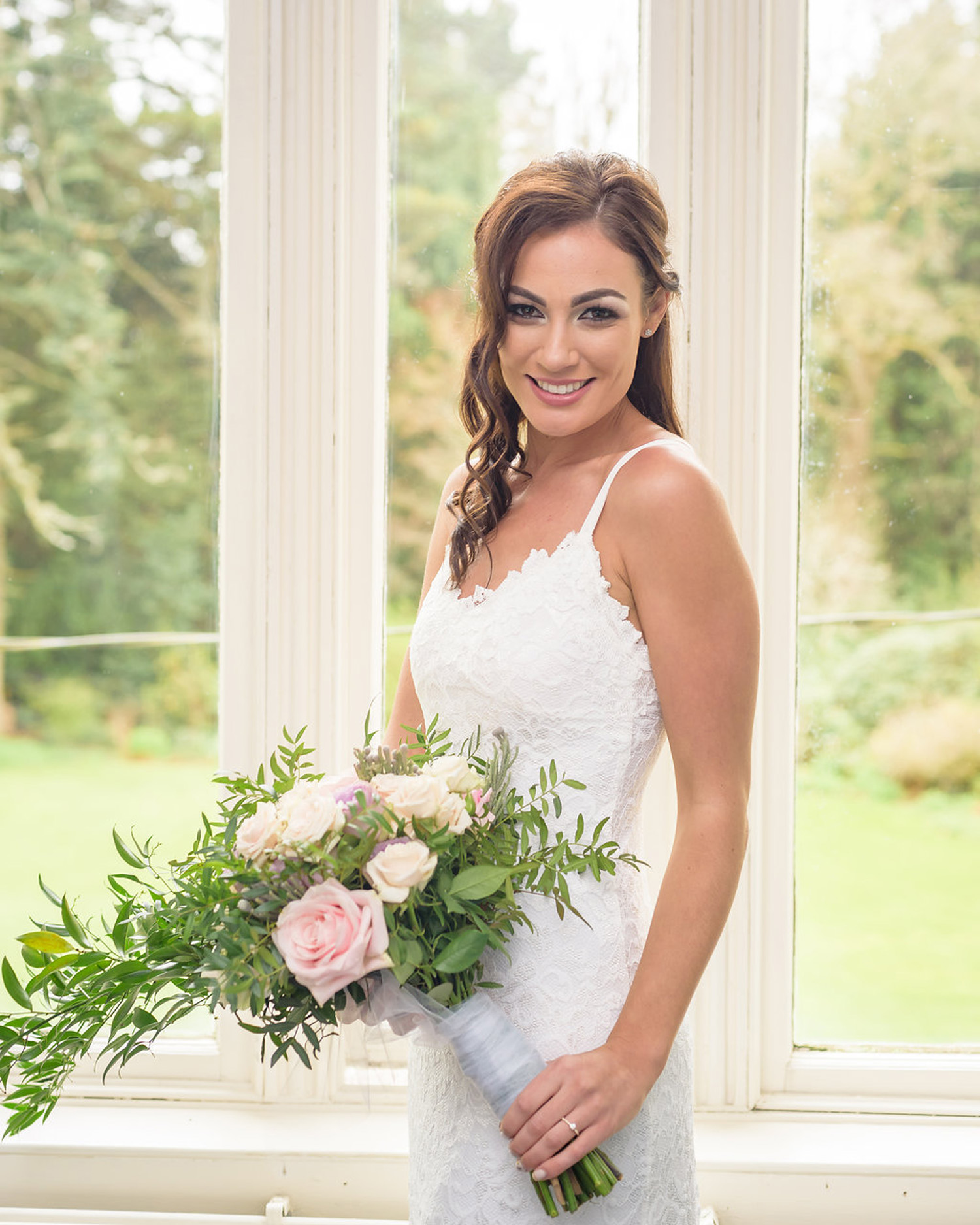 elope to ireland bride ready to get married standing with flowers A fun Elopement at an Irish Manor House Adventure