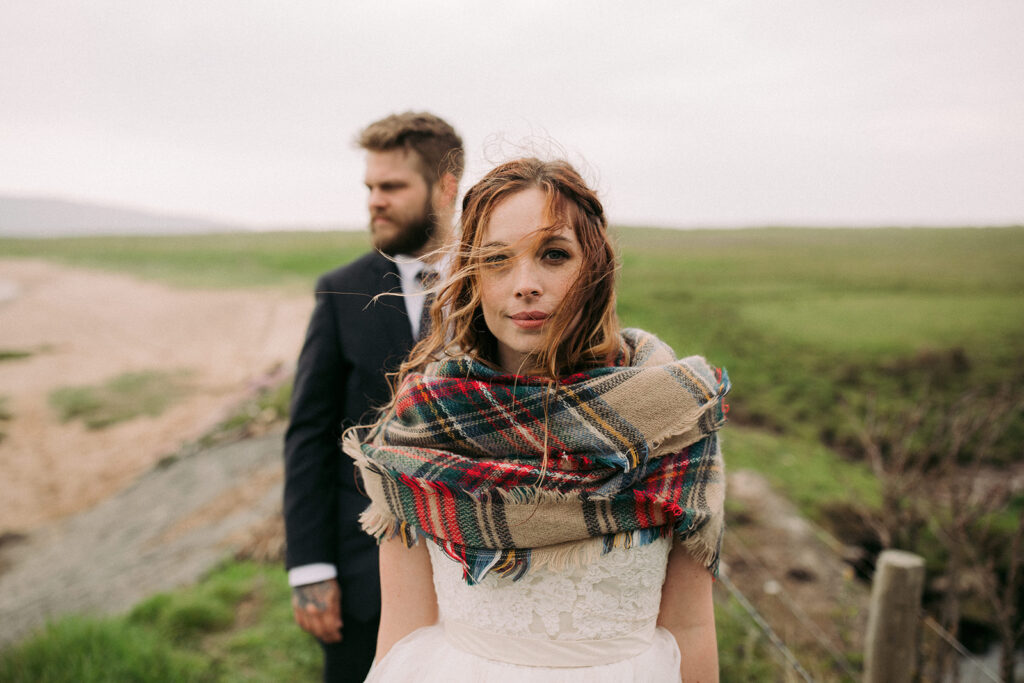 A Coastal intimate Wedding in Ireland here the bride looks in to the camera 